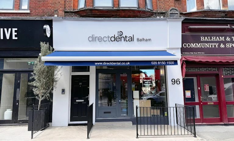 Direct Dental Balham — Balham High Road shopfront with blue awning and the practice signage.